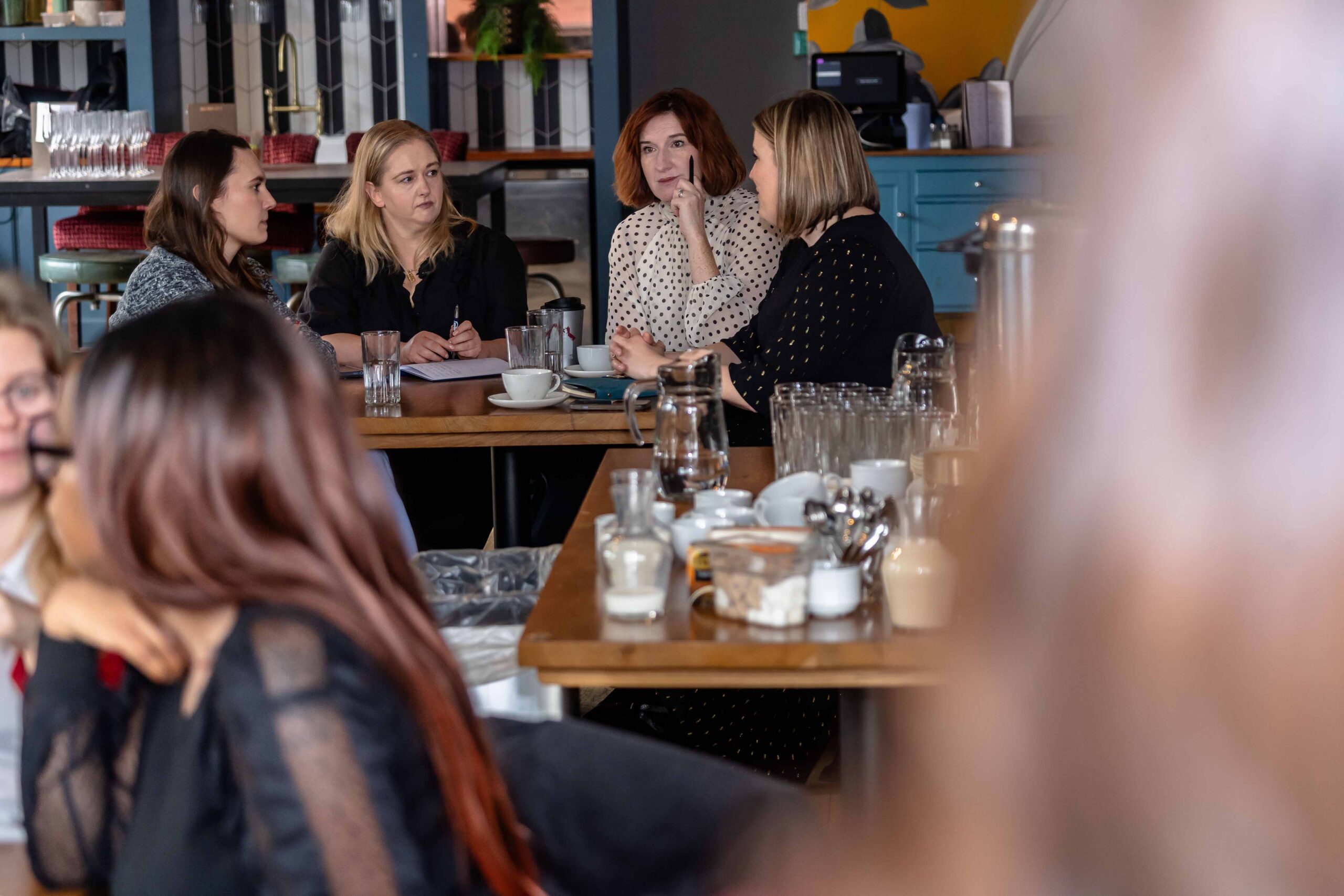 She Builds Birmingham event, attendees networking at table